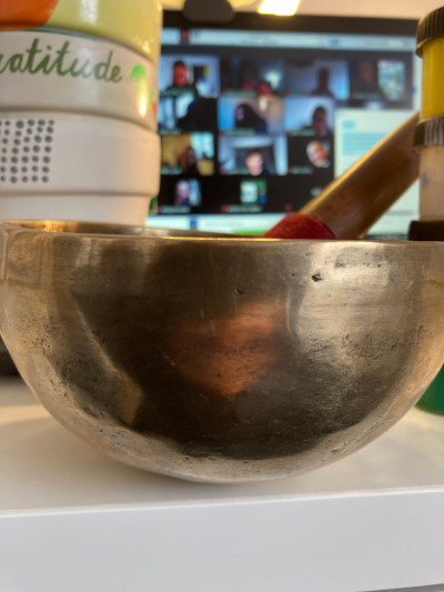 mindfulness training session on zoom behind a silver bowl